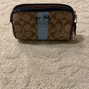 Coach Cosmetic bag light blue and navy patten leather trim